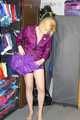 Pia enjoying a cupboard full of shiny nylon clothes trying on purple shiny nylon shorts and rain jacket (Pics)