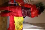 Watching sexy Jill wearing a sexy red shiny nylon rain pants and a red/ purple downjacket lolling in her bed (Pics)