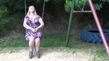 Miri cuffed on a swing