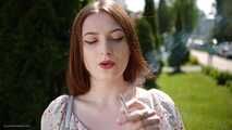 18 y.o. Sasha is smoking two white 120mm cigarettes outdoors
