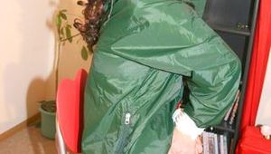 Beautiful archive girl tied and gagged on an chair wearing sexy shiny nylon shorts and a green down jacket (Pics) 