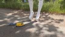 Model car crushing beside the motorway