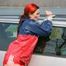 Jill tied and gagged outdoor on a car wearing a sexy red shiny nylon shorts and an oldschool rain jacket (Pics)