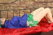 Mara tied and gagged on a princess bed in an old cellar wearing an supersexy shiny green nylon shorts and a blue rain jacket (Pics)