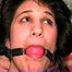 19 Yr OLD LATINA HOUSEWIFE IS BALL-GAGGED, CHAIR TIED, HANDGAGGED WEARING LINGERIE, NYLONS & HEELS (D63-16)