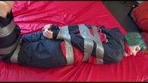 Mara tied with tape, gagged and hooded on bed wearing sexy oldschool shiny nylon rainwear (Video)
