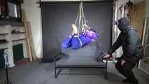 Marie M bound and suspended in shiny nylon down