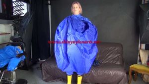 Watching sexy Pia wearing sexy blue shiny nylon rainwear and yellow rubber boots raking leaves (Video)