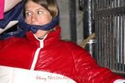 Katharina tied and gagged in a shiny nylon downjacket