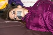 Shelly tied and gagged in a shiny nylon rainauit 