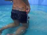Get a Video with Sandra cleaning the Pool in her shiny nylon Shorts