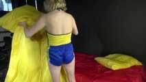 *** Sexy MIA wearing a blue shiny nylon shorts and a yellow top during changing the cloths on her bed  (Video)***