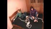 Catt and Alexa - Naughty girl tied up before joining helpless girlfriend on the bed (video)