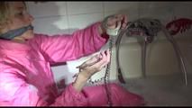 Sonja ties and gagges herself in the bath tub with cuffs wearing sexy shiny nylon downwear (Video)