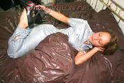 Stella lolling on bed and posing outdoor wearing sexy shiny nylon rainwear jumpsuit (Pics)