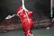 Watch Sandra bound gagged and Pantyhooded wearing her shiny nylon Rainwear