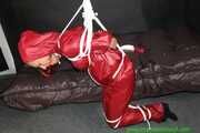 Watch Sandra bound gagged and Pantyhooded wearing her shiny nylon Rainwear