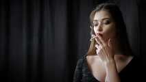 Gorgeous babe Irina posing on camera while smoking a cigarette