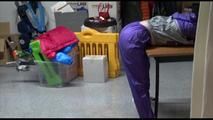 Jill tied and gagged on a table wearing a shiny purple/silver PVC sauna Suit (Video)
