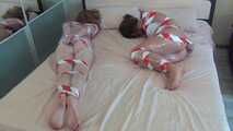 Elsa and Christina Clark - Wrapping games with red and white duct tape (video)