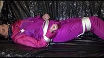 Mara tied and gagged on a sofa wearing sexy pink/purple downwear (Video)