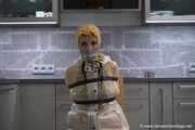 Miss Amira in 2 Hunter rain jackets and nylon rain pants gets tied up and gagged