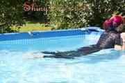 Mara sunbathing and swimming in the pool wearing a supersexy black adidas shiny nylon rainwear (Pics)