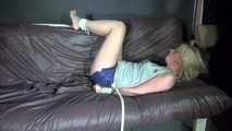 Sexy Pia being tied and gagged with ropes and a cloth gag on a sofa wearing a sexy black shiny nylon shorts and a grey tshirt (Video)