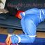 Katharina tied and gagged on a sofa wearing blue shiny downwear (Pics)