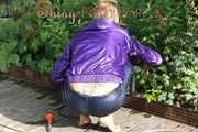 Watching sexy Sandra watering the flowers in the garden and lolling in the sun wearing a sexy blue shiny nylon rain pant and a purple down jacket (Pics)