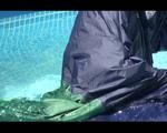 Mara wearing sexy shiny nylon rainwear while taking a bath in the swimming pool (Video)