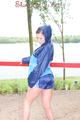 Enni wearing sexy shiny nylon shorts and rain jacket while stretching herself on a sea (Pics)